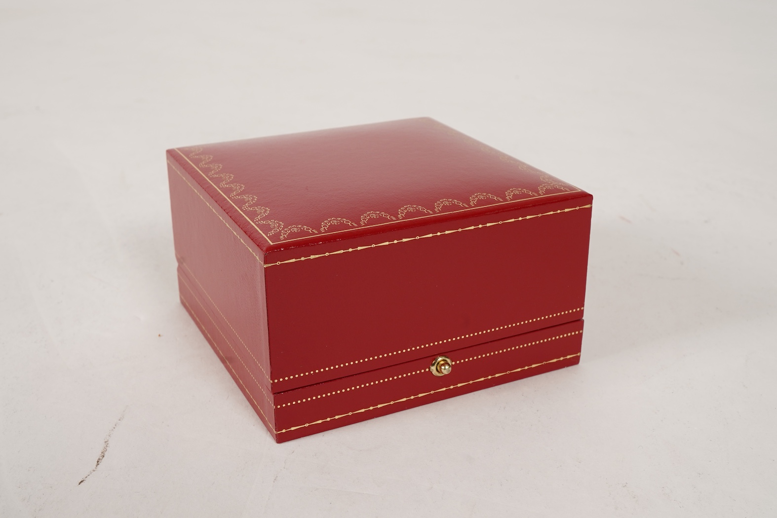 A recent Cartier paperweight, modelled as a panther upon a blue glass sphere